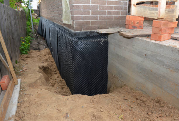 Happy homeowners after waterproofing job in Feesburg